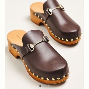 By Anthropologie Dark Brown Horse-Bit Clogs with Gold Details